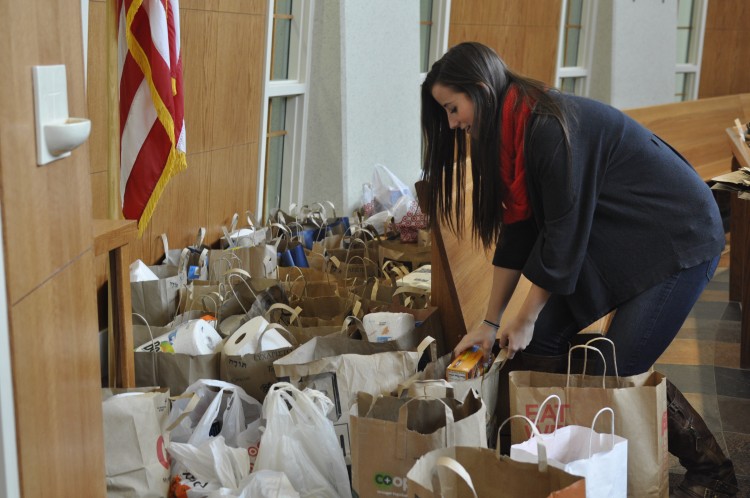Volunteers helped take the food donated at the Freshman Food Drive this past Friday to PRISM food shelf.