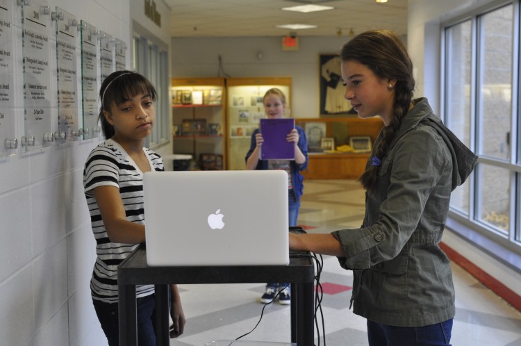 Students put together a lab for their science class using the technology on their laptops. 