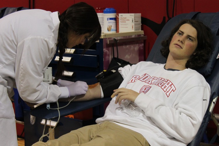 Junior Mike Ryan donates blood in the Memorial Blood Drive, hosted twice a year by BSMs National Honor Society. 