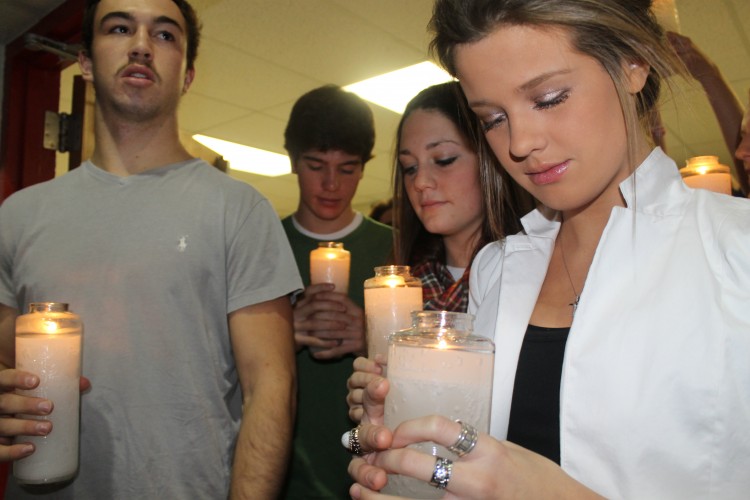 Seniors lined up in the hallway before they processed in with candles at the beginning of the service. 