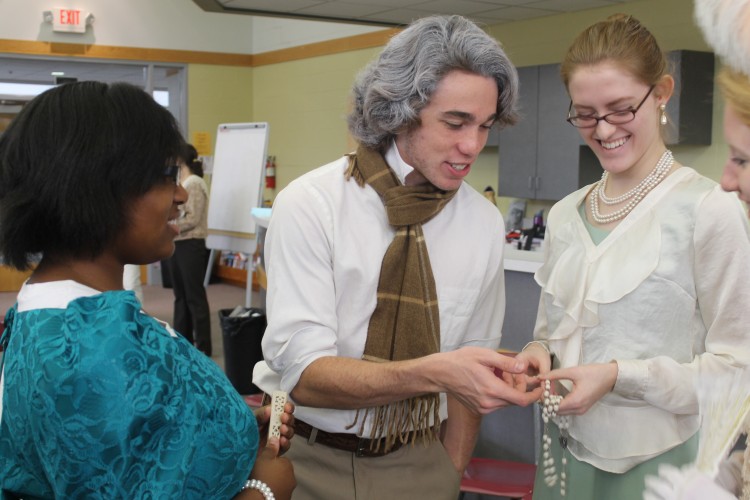 Seniors, Andrew Phaff and Precious Walker, participate in the AP European History classs Enlightenment Salon.