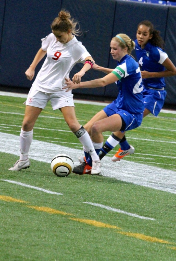 Senior forward Dana Buckhorn fights to weasel the ball away from Blake player Hannah Randolph. 