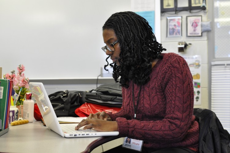Amity Scholar Milaye Jean prepares presentations for French classes.
