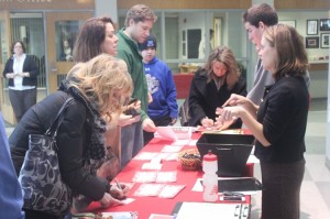 Perspective students and parents sign in for an open house.