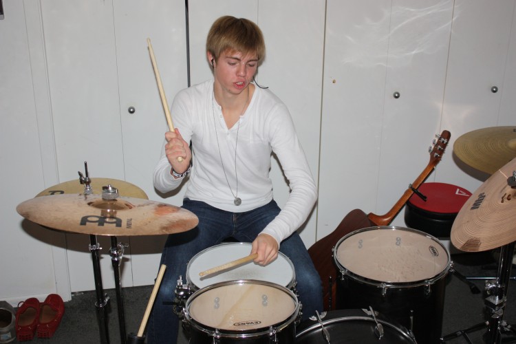 Junior Lars Oslund, one of the three members of Falling From Friday, wrote the bands first single Stepping Out.