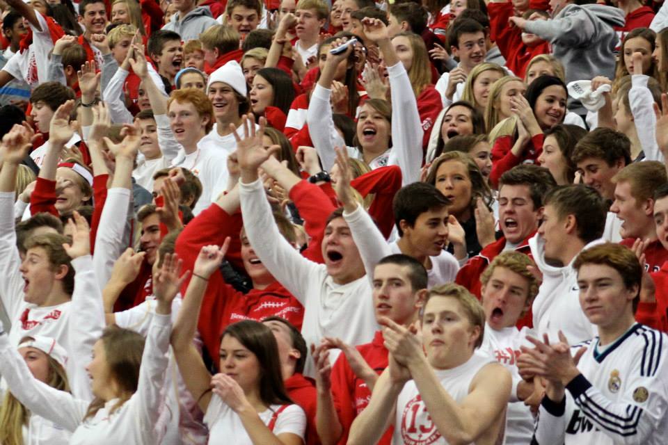 Cheering+students+worked+to+create+a+lively+fan+section+at+the+game.+