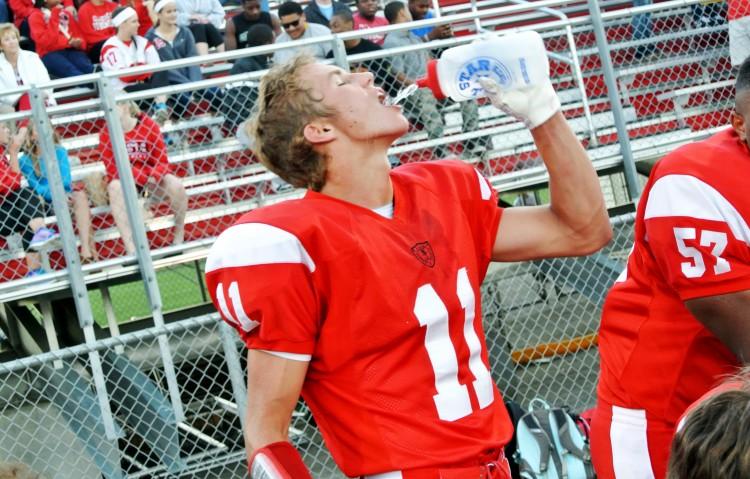 The football team has coaches who emphasize the importance of hydration, both on and off the field. 