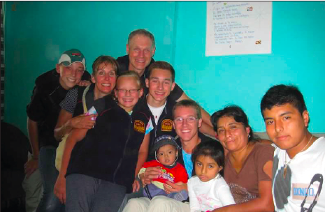 The Melin family visited with a family during their travels to Flores De Villa, Peru, last summer. Their trip included aiding their church in building homes for struggling Peruvians.