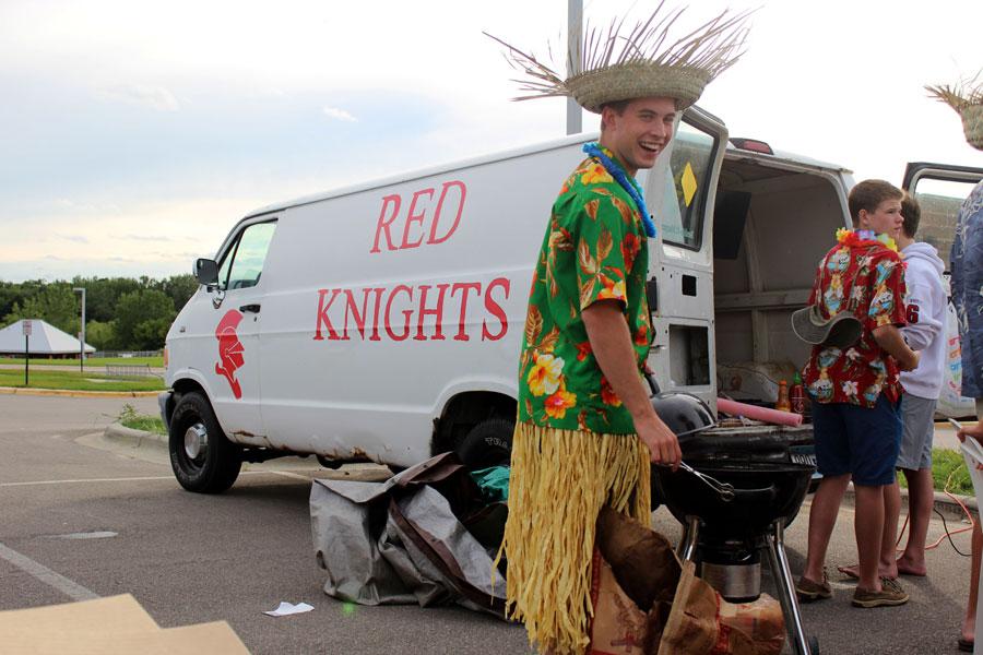 Senior+Ben+Newhouse+leads+the+tailgate+at+the+BSM+vs.+Chaska+game%2C+with+the+Fan+Van+in+the+background.+