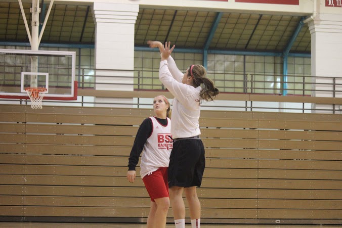 Senior captain Allie Coughlin takes a three-point shot in practice.