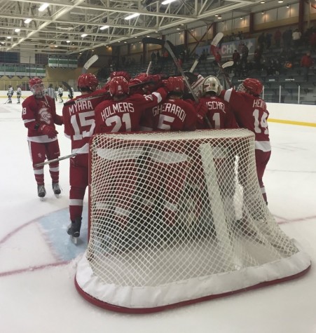 The Red Knights parade around the net after a 4-2 win over Woodbury.  The team is currently 12-0-1.