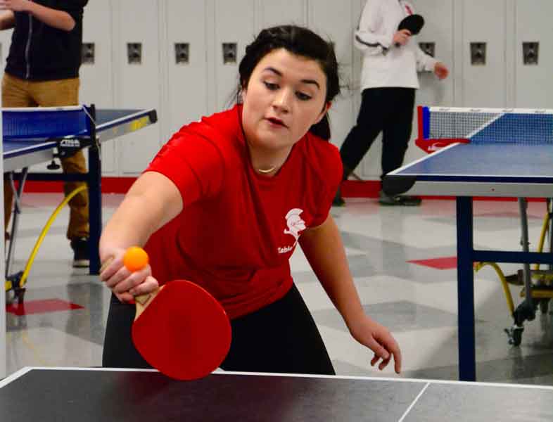 Sophomore Alyssa Brinza gets ready to return the serve in a recent ping pong practice.