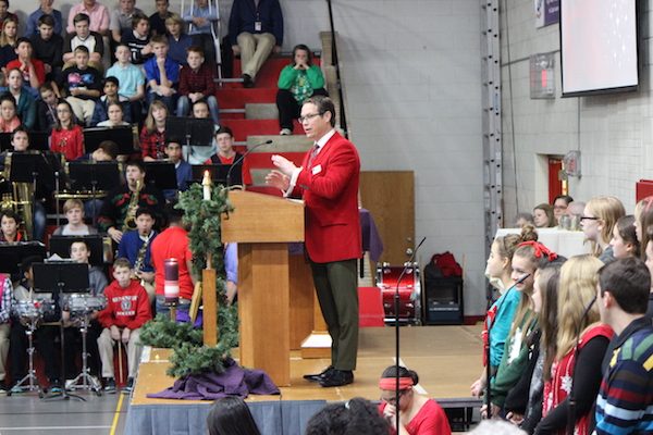 Dr. Gyolai congratulates Parece on being awarded the Dear Neighbor Grant during Christmas mass. 