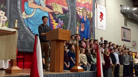 Performing his song with the accompaniment of the choir and the piano, Matt Hansberry premiered his original song at mass.