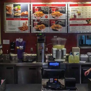 Raising Cane’s counter seldom seen without a line of customers and cashiers frantically taking orders.