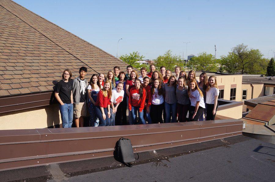 The former junior high students who lobbied for the solar panels stand with Dr. McNamara as they figure out where on BSMs roof the panels are to be located. 