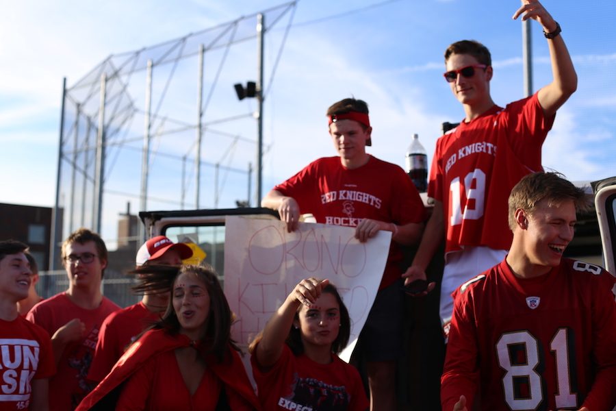 Seniors Lucy Scherer, Max Jablonski, Derek Drees, Laura Deutz, Tommy McGinn, Brian Arnold, and Michael Wexler all get excited for the big game at a tailgate.