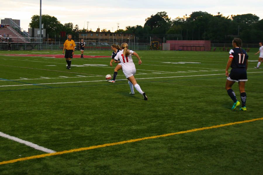 Junior midfielder Claire Van der Heide chases after an Orono player in pursuit of the ball during a 4-1 win.