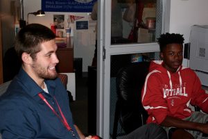 Mr. Sawyer Phillips sits with Freshman Micah Cade at a lunchtime conversations in the Campus Ministry. These conversations provide an opportunity for students to discuss their lives and school events in an environment outside the cafeteria.