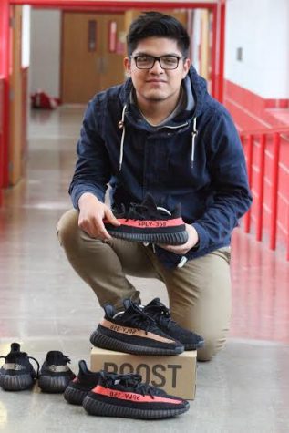 Senior José Machuca shows off his invested pairs of Yeezys by Kanye West to sell via Facebook. Machuca has been selling all sorts of brand name sneakers for about two years, and he plans to create an online website by this time next year.