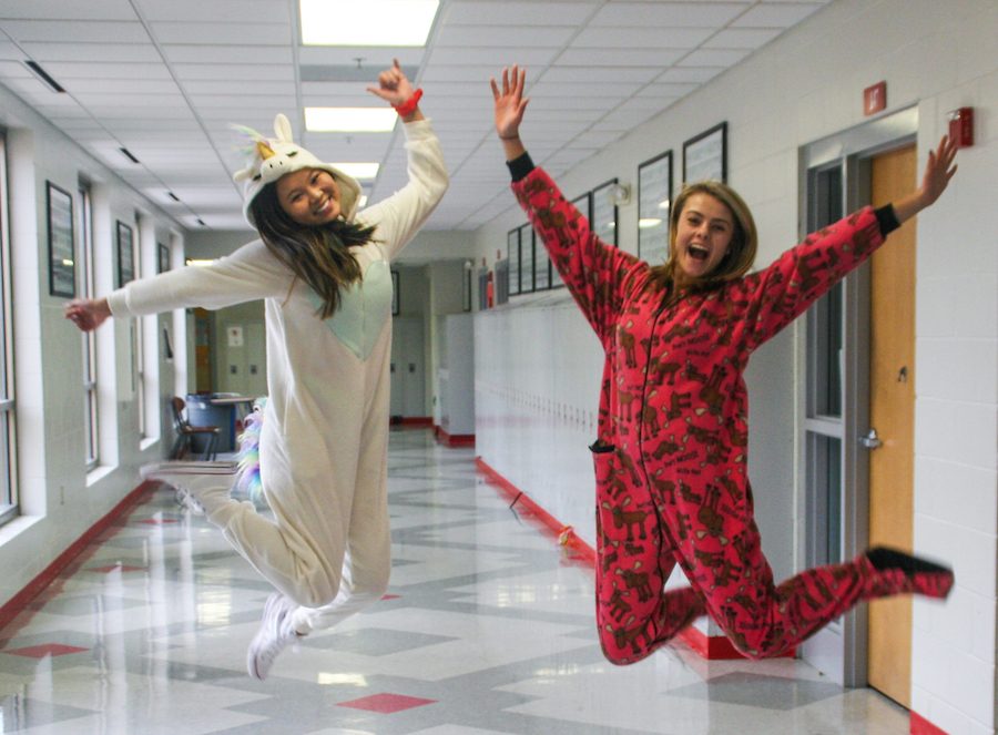 Kathryn+Hansen+and+Natalie+Kroll+jump+for+joy+in+their+onesies.+Tuesday+was+declared+by+the+National+Catholic+Educational+Association+as+a+day+for+Celebrating+your+Students%2C+and+BSM+interpreted+this+by+giving+students+the+gift+of+comfort.