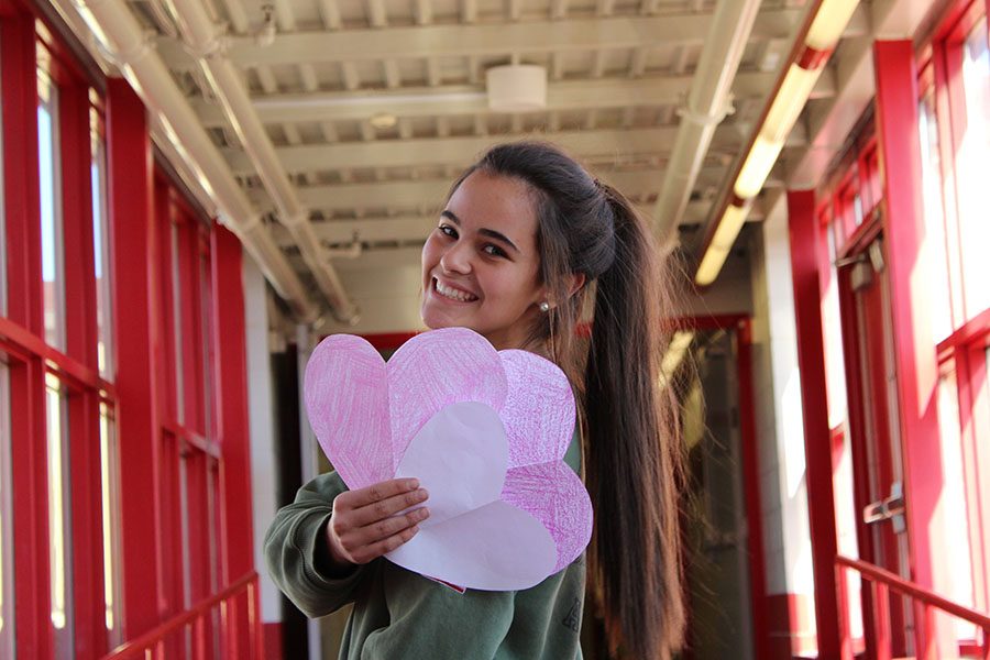 Frida Fortier holds three hearts while day dreaming about Will Hodder and Tommy Anderson.
