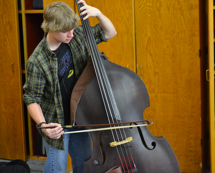 Spencer Becker plays both electric and upright bass