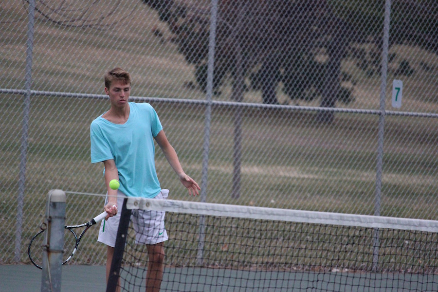 Senior captain Dawson Spindler prepares to hit the ball during practice.