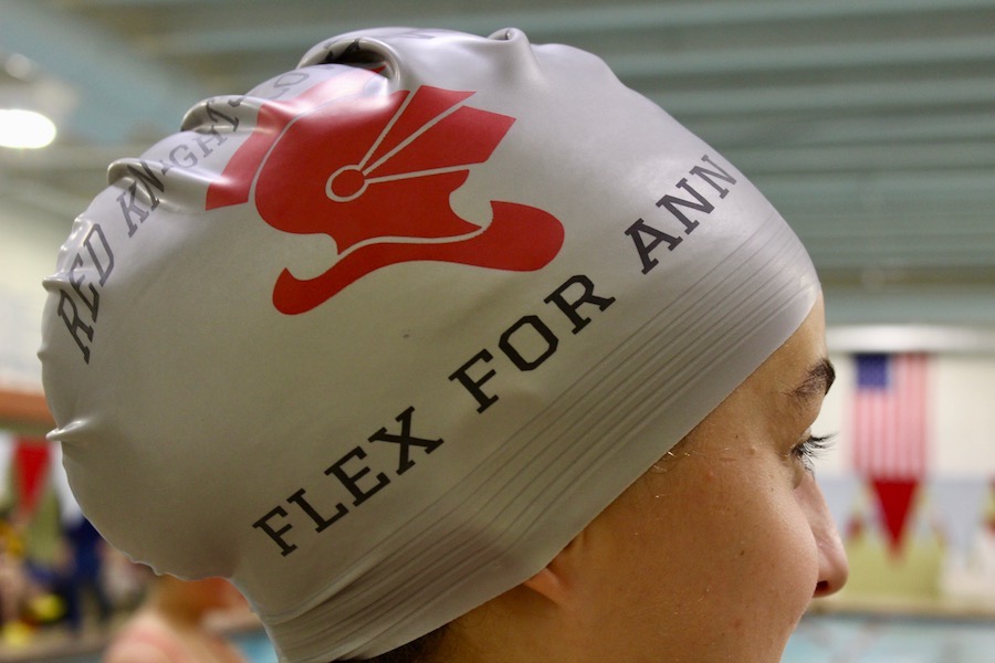 The girls swim team dedicated their first home meet of the year to Ann Dickey.
