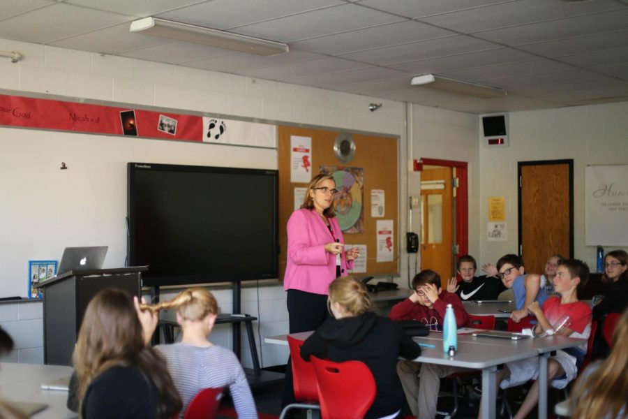 Principal Dr. Susan Skinner teaches religion to junior high students.