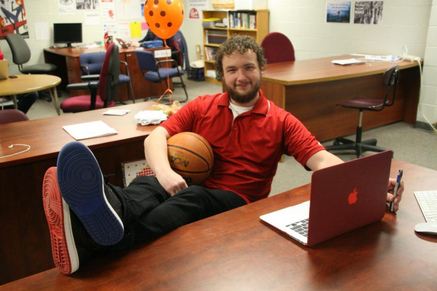 Bill Cheney lounges at his desk in a pair of his signature kicks.