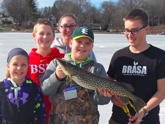 Ice fishing can often give students the opportunity to catch big fish, like this Northern Pike.