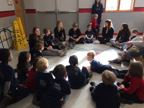 After the French III students read their stories, the younger children played Duck-Duck-Goose.