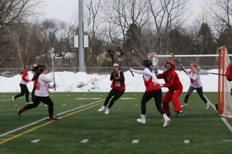 Despite the snow surrounding the field, members of the girls lacrosse team get ready for the season. Personal workouts and captains practices have been a part of their off-season preparation.