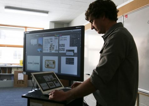 Teacher Zach Zimney uses technology often to teach his graphic design classes.