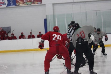 #20 Joe Collins gets in position for a faceoff.