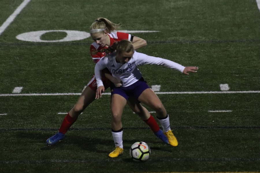 Ashtyn Lowenberg forces ball out of bounds, killing time in BSM's 3-0 win.