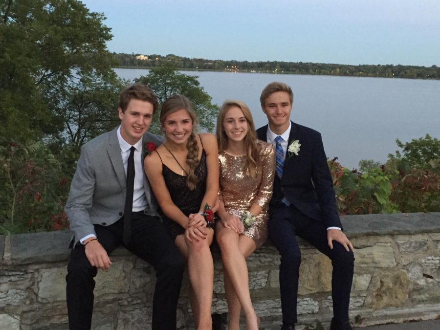 Current seniors Taylor Damberg (left center), Abby ONeil (right center), and Carter Chapman (far right) pose for photos during their freshman homecoming. 