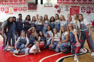 Senior girls show off their overalls at the annual homecoming pepfest. 