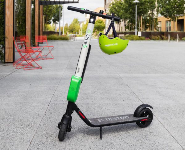The Lime scooters have a dazzling green design with a matching helmet.