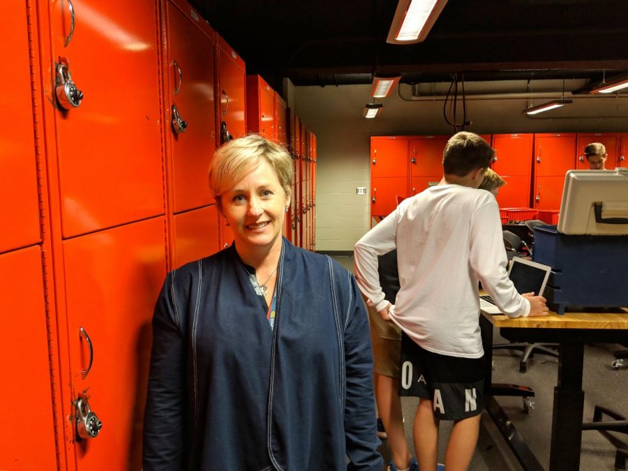 New teacher, Ms. Anne Dougherty, in the engineering room. 