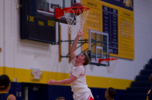 Junior Zach Carden goes up for a shot to help the Red Knights get a win.