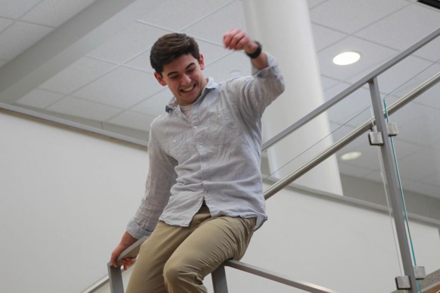 Giving new meaning to the term senior slide,Matt Hansberry literally slides down the railing in the new Atrium. Many seniors look forward to the senior slide, which typically begins in late April to early May. 