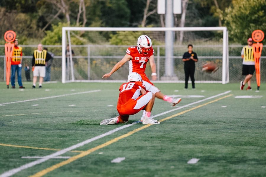 Louis Hyde kicks the ball for an extra point during a BSM football game.