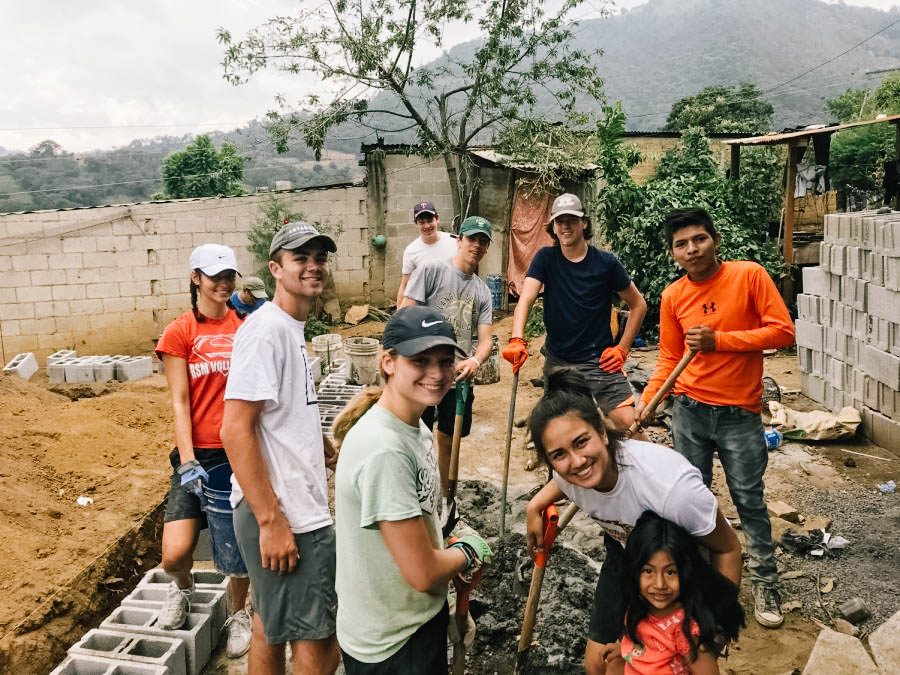 Kiara Herro, Matthew Nachbor, Claire Hennen, Grace Lira, Nic Dokman, Sam Decker, and Quinn Van Oort work together to help build a house for a Guatemalan family. 