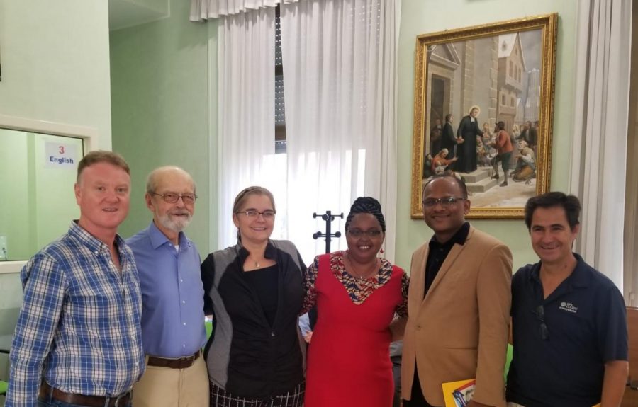 Dr. Susan Skinner stands alongside members of her group. 