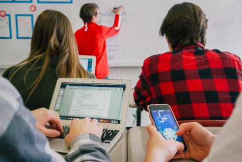 Students are impacted by technology use of both phones and school-issued laptops in the classroom.