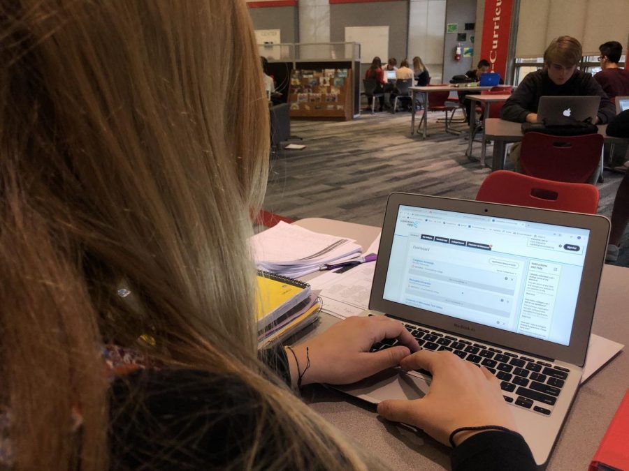 Senior Grace Melin works on her applications through the CommonApp website. 