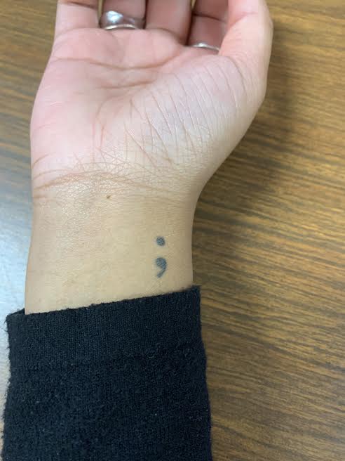Jacinda Smith has two tattoos: a semicolon on her wrist and her mom’s birthday on her forearm.