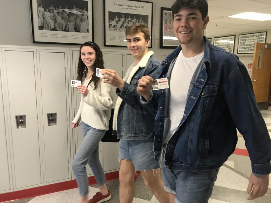 Seniors Reilly Rahill, Zach Carden, and Blake Mahmood take advantage of walking the halls with IDs instead a hall pass 